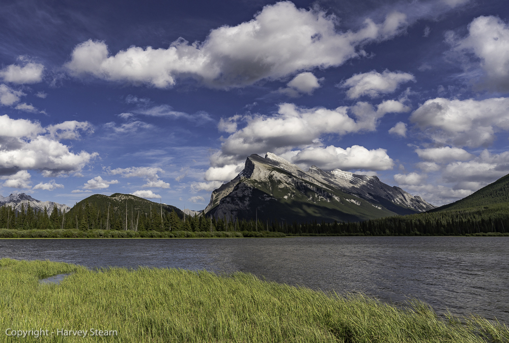 Wind-driven clouds move across the Canadian Rockies
