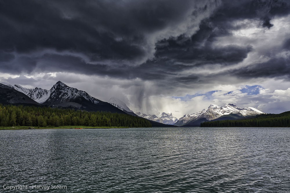 Rain storm passes over Maligne Lake in Jasper NP