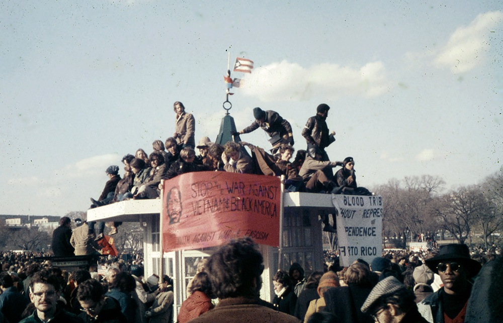 Regardless, it’s a historical shot for me, being a snap I made during an anti-war demonstration in DC almost fifty years ago. I scanned it and got to work on the color shift and contrast, plus a good deal of Healing Brush work to clean it up a bit (though there’s still more work to be done.