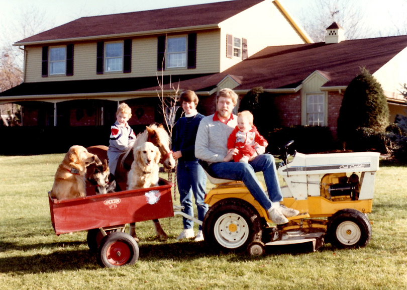 A family portrait from the 80's less one of my boys who wasn't born yet. Three dogs, one pony, my favorite tractor. Truly different times.