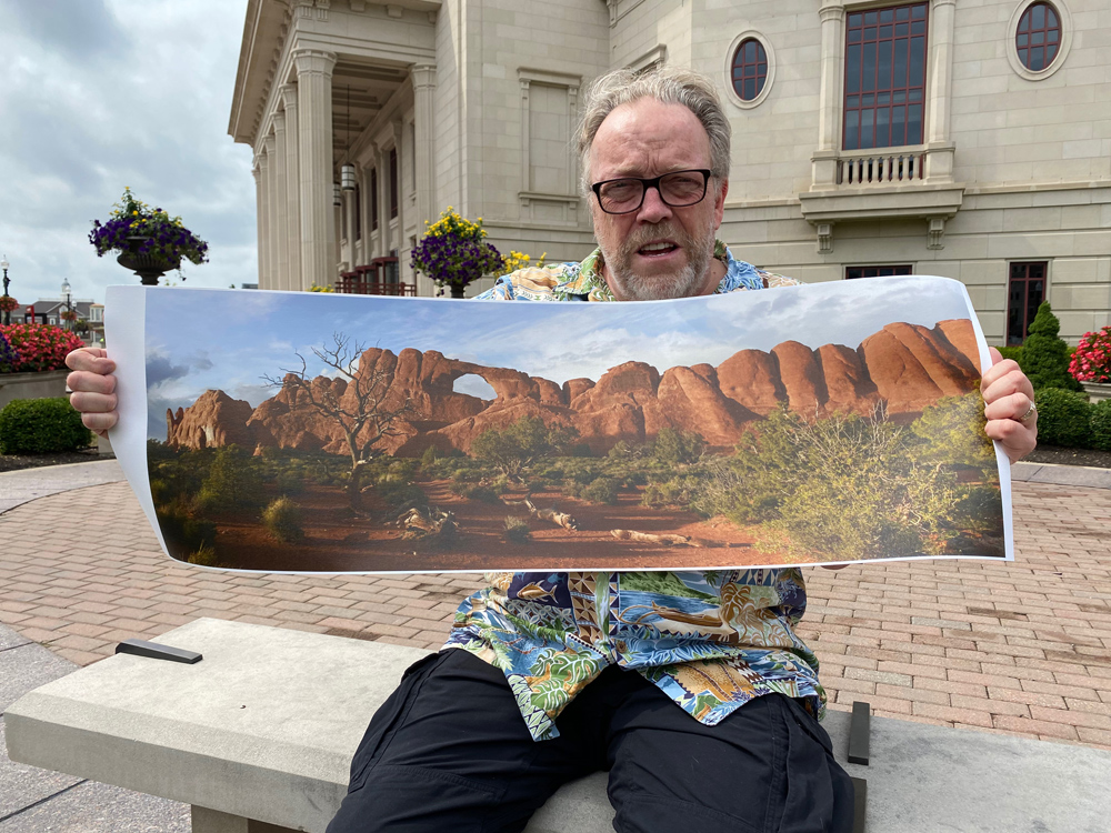 Me holding the final print, made on canvas