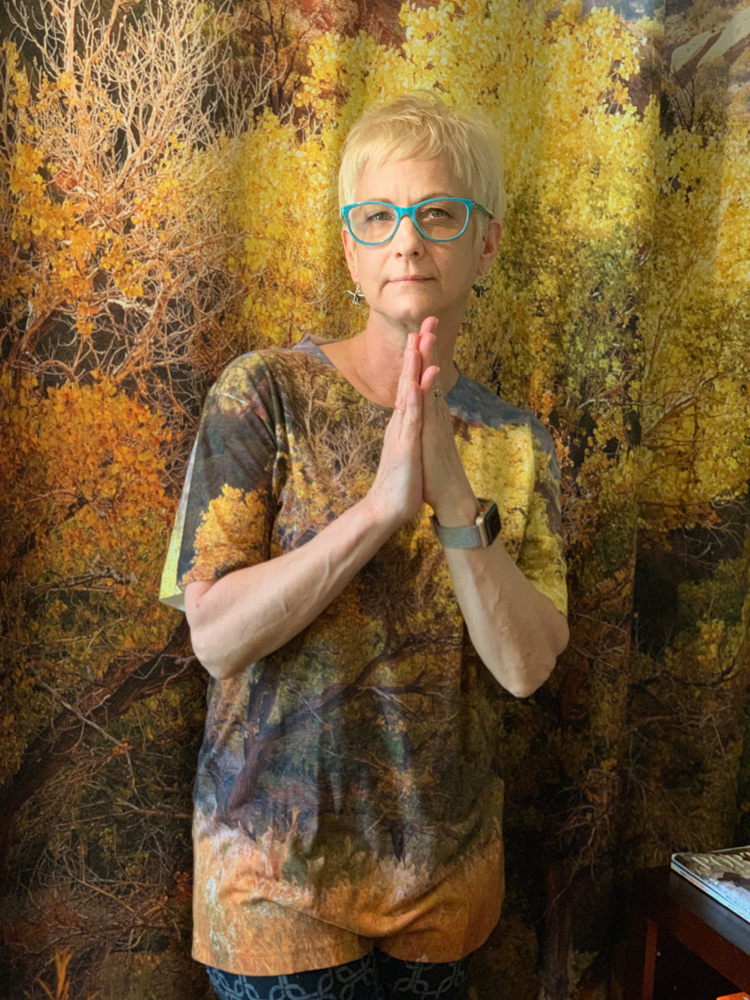 Debra in one of our t-shirts with the shower curtain as the background