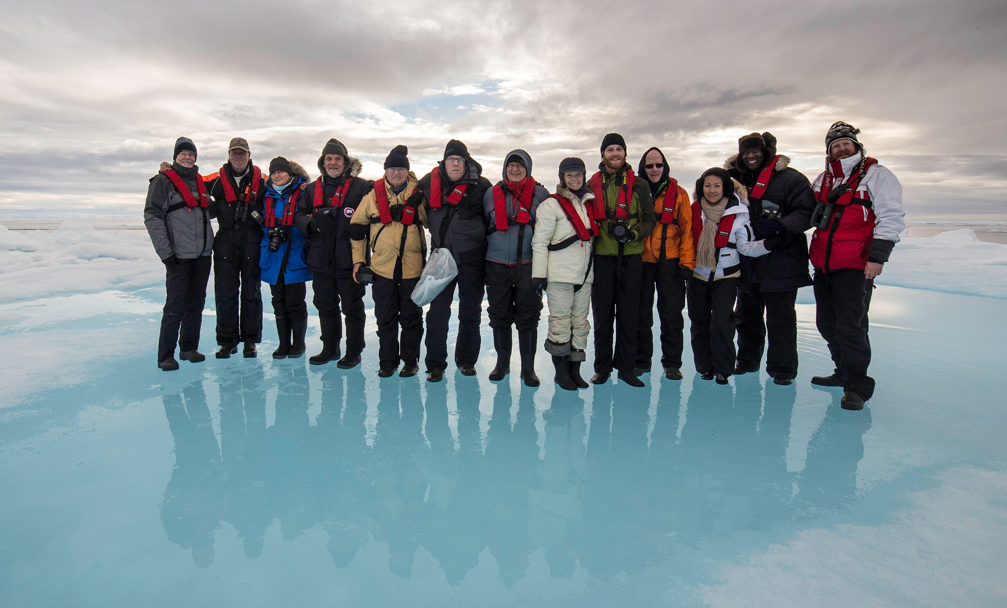 Group photo from a previous trip on an ice flow in the Arctic Ocean