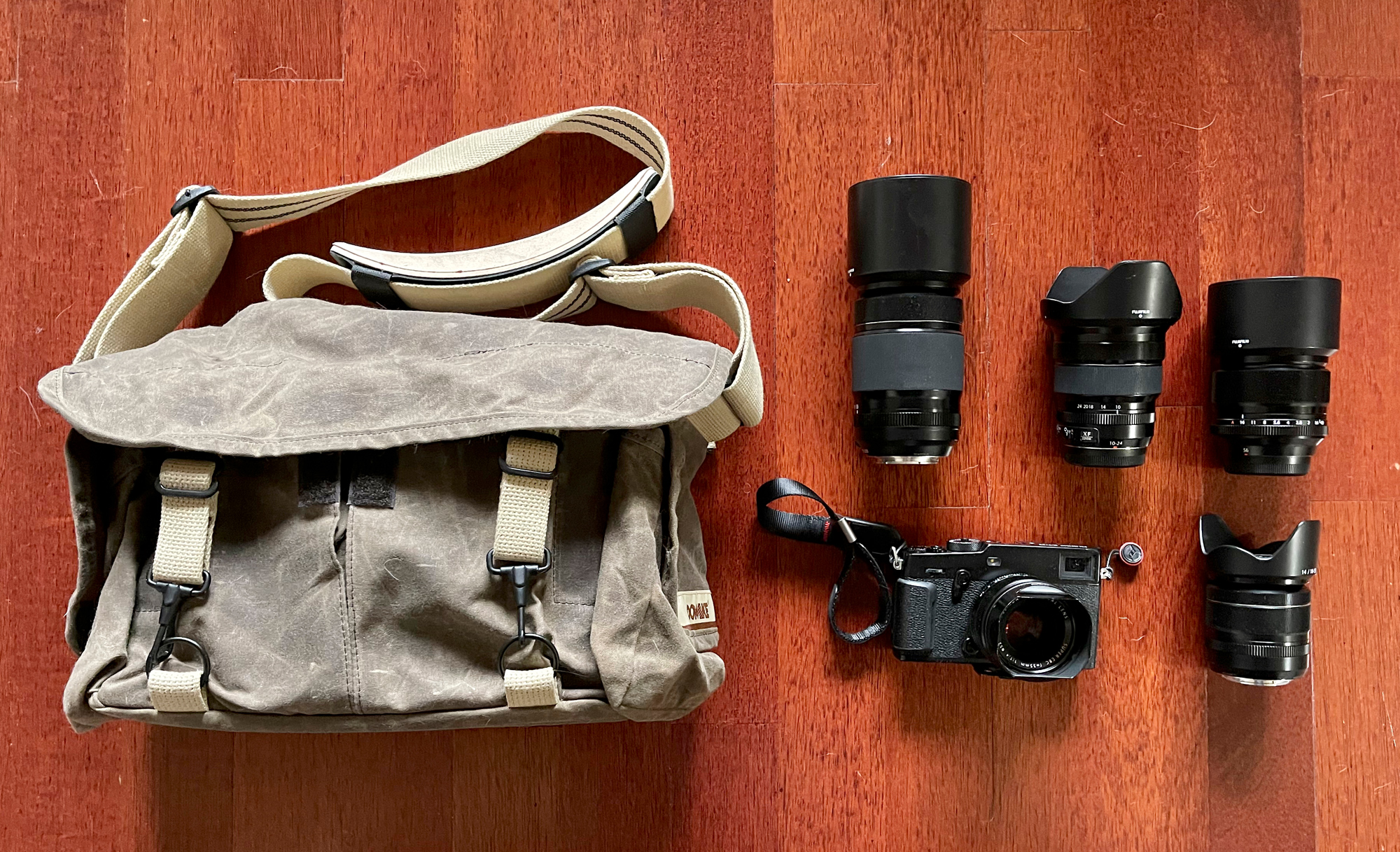 My former Fuji X-Pro3 kit. A 55-200mm, 10-24mm, 56mm 1.2, 35mm 1.4, 18-55mm. All of these fits into one of the best camera bags of all time the Domke bag.