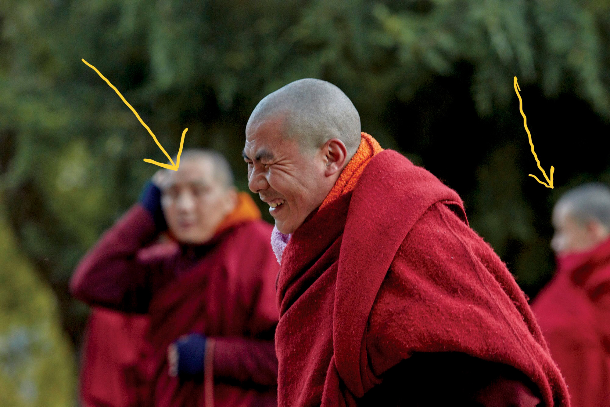 In the next photograph, the subject is much more dominant and it is clear what is being photographed. However, it's not what we have included, but what hasn't been excluded that is the problem. The two monks in the background are confusing and so this framing is not successful.