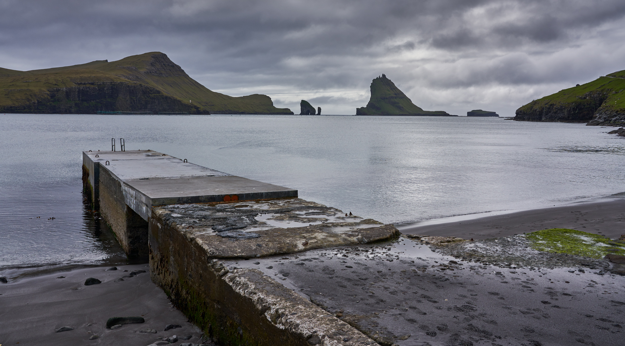 The lines work with this shot. The wharf fills in the dead space and carries your ey to hills. Thos sea stacks we will be traveling to by boat on this upcoming trip. I can't wait to see what we come up with.