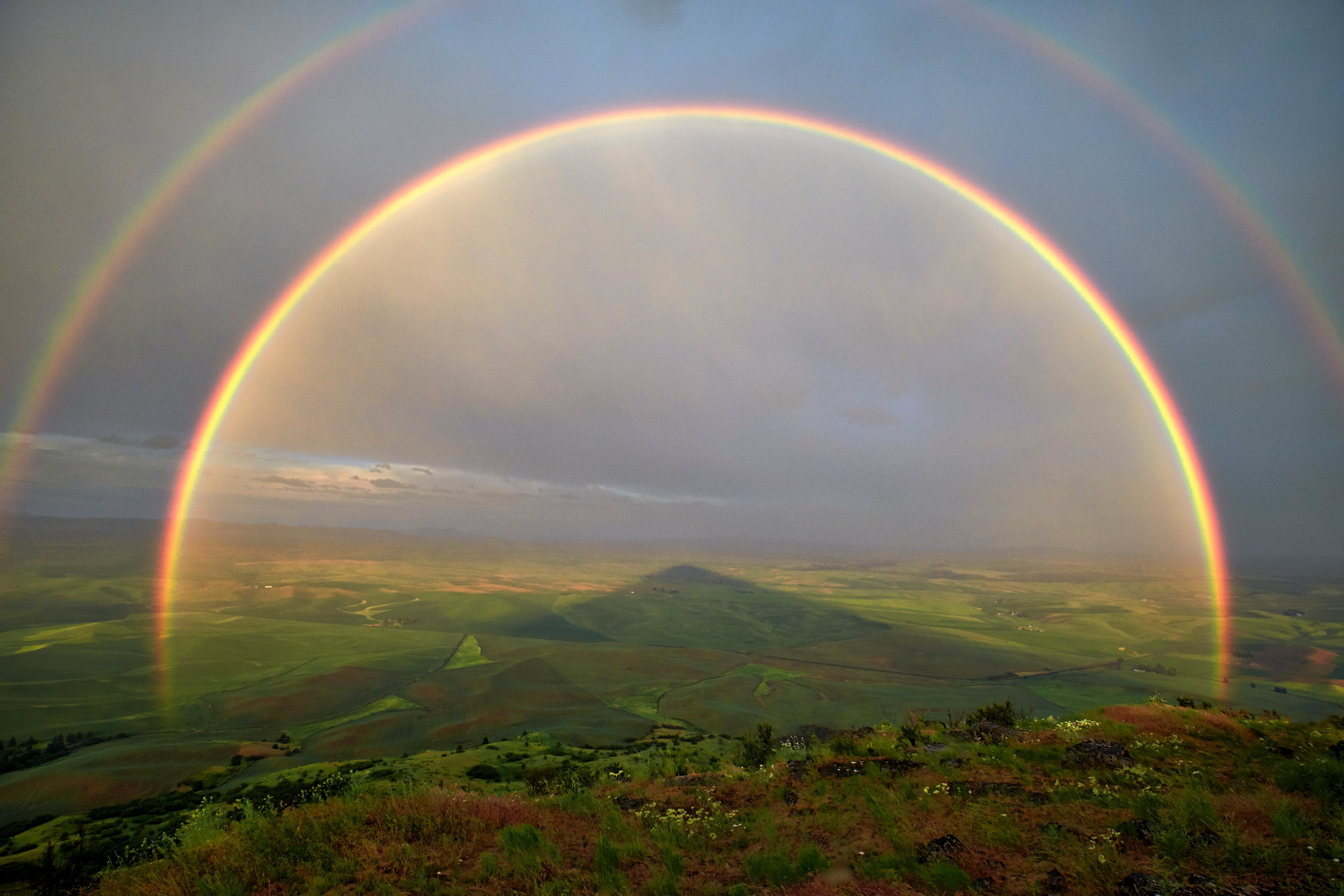 Double rainbow from the top of Steptoe Butte. You can even see the mountain's shadow. If we see a storm coming we will chase it.