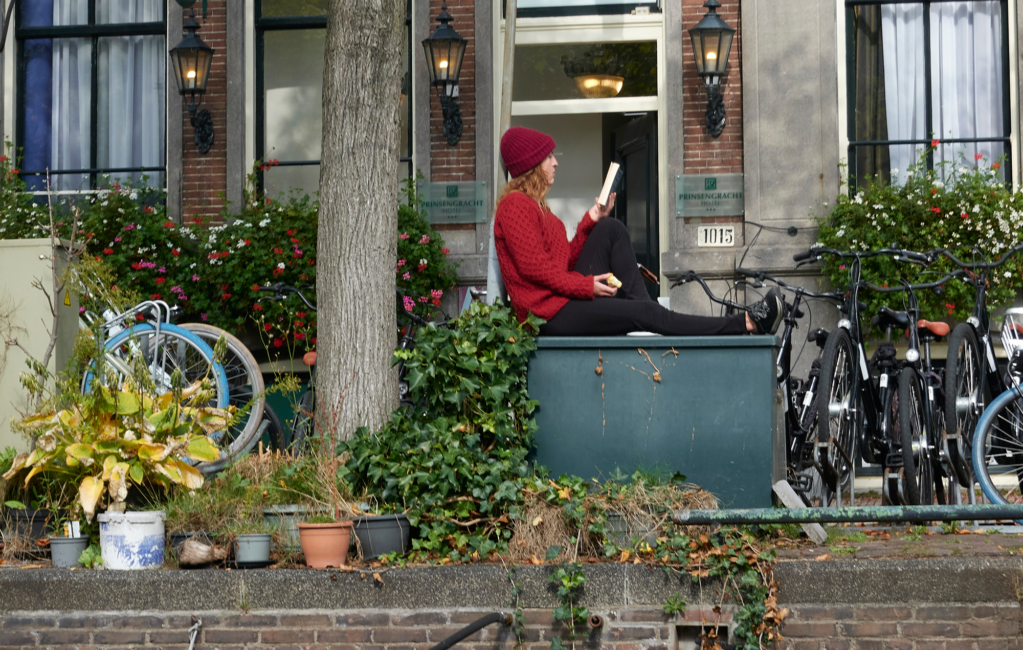Girl reading a book in Amsterdam