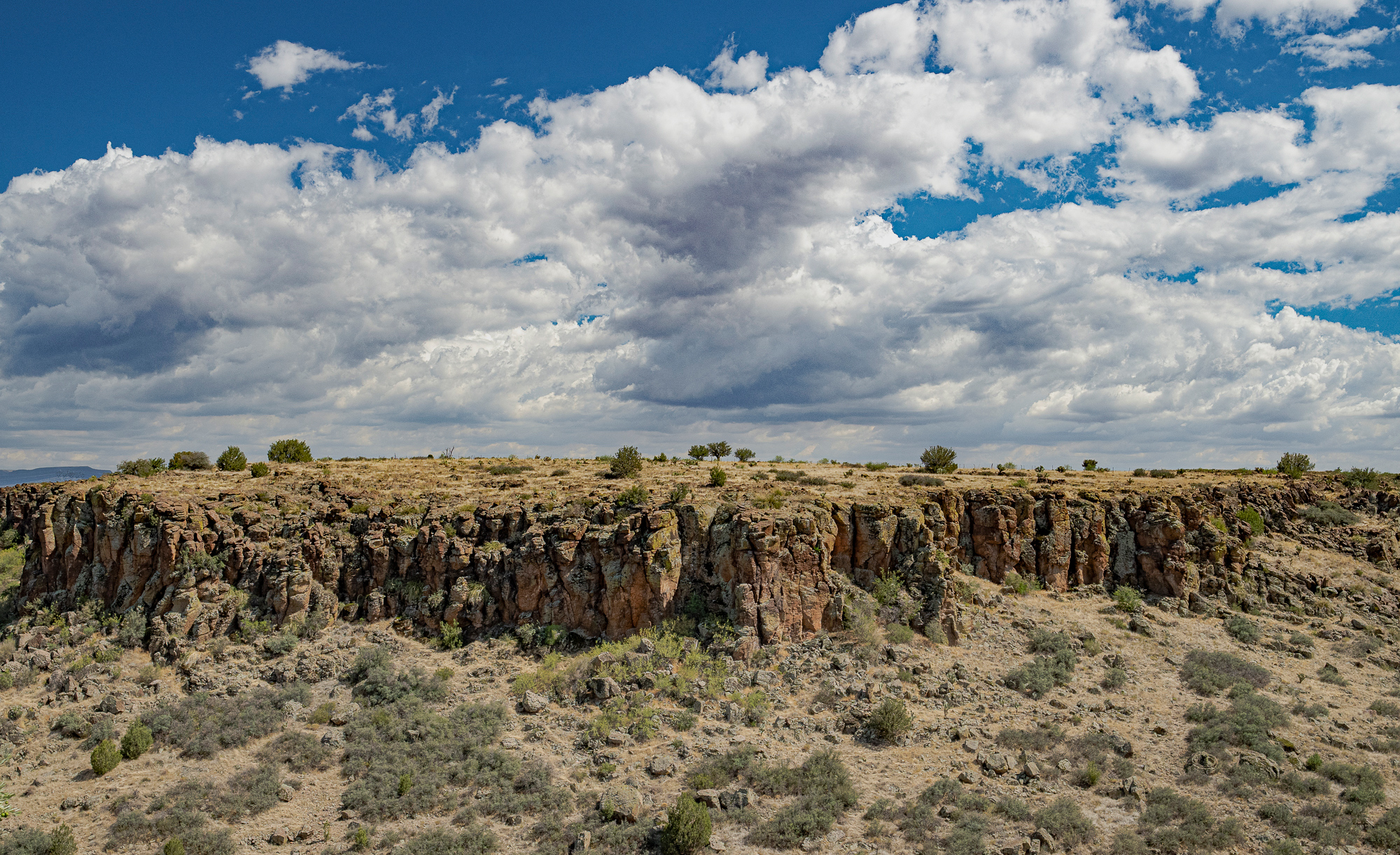 Clouds Building Over Desert Plateau”, Arco Santi, AZ