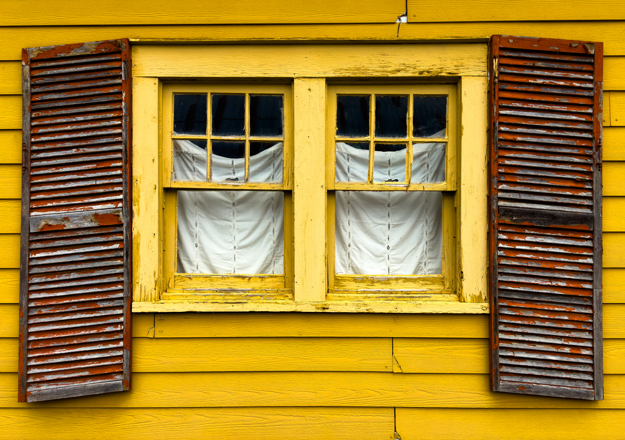 I am always looking for a shot. Thought this window and sagging shutters looked pretty cool