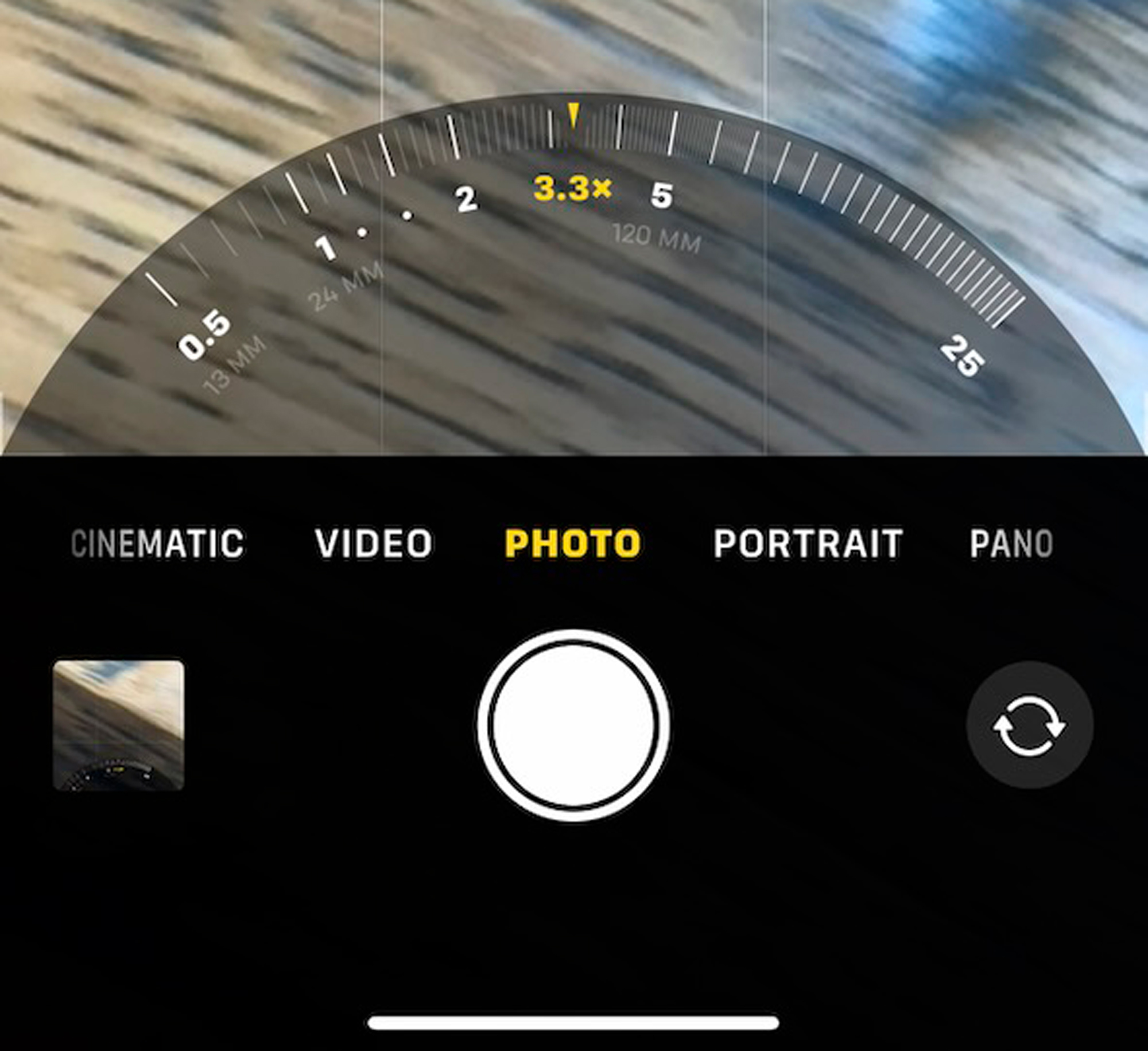 By holding any of the camera setting buttons you make a dial pop us showing the full range of capture magnifications available. You can also see 35 mm equivalent focal lengths