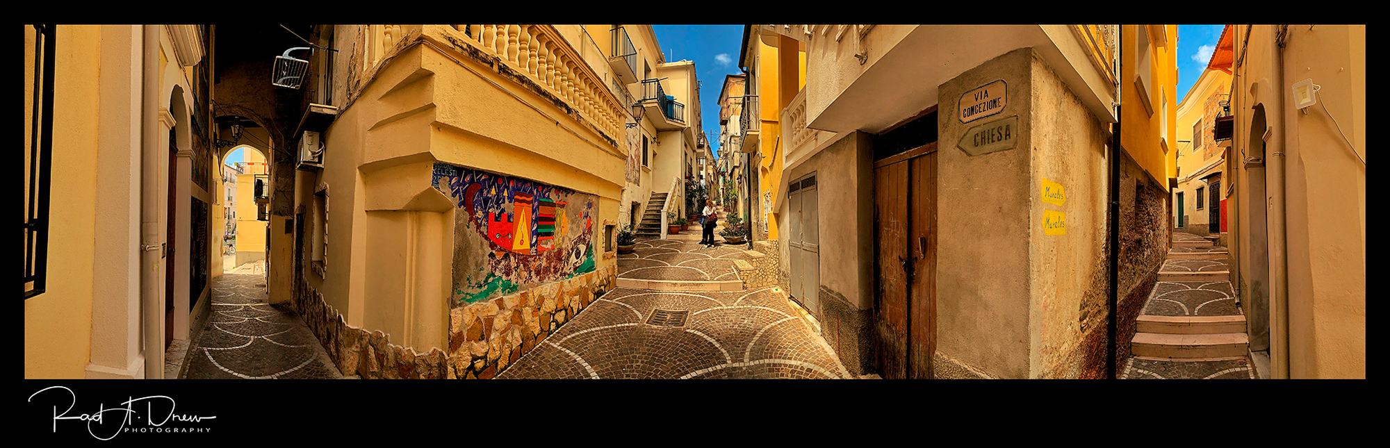 Horizontal Pano of three intersecting streets in Diamante, Italy, appear to be almost parallel.