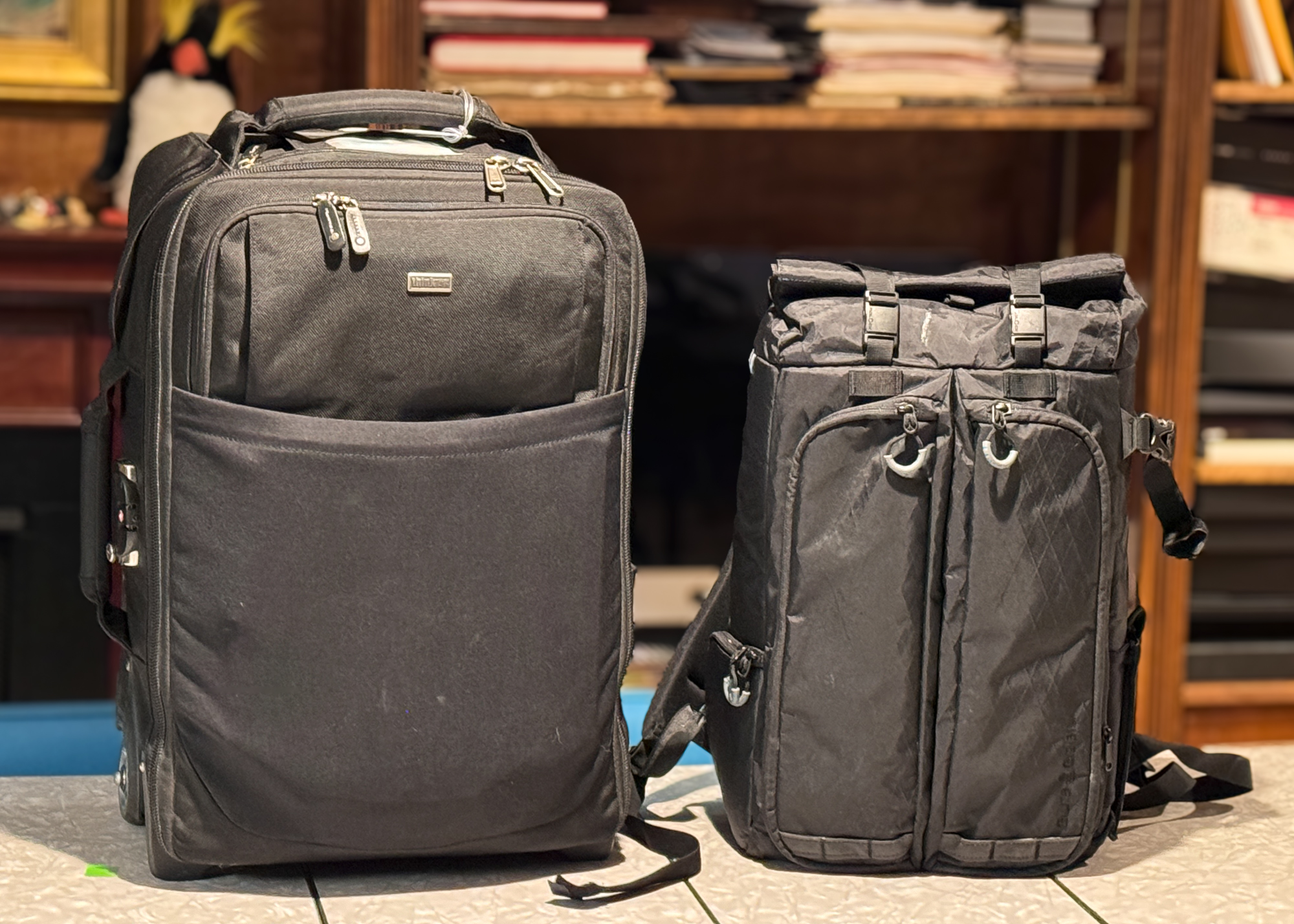 This is my travel Duo. I use the Airport Security from ThinkTank and the Gura Gear Kibota City Backpack. This backpack has a handle that slides over the handle on the Airport Security roller.